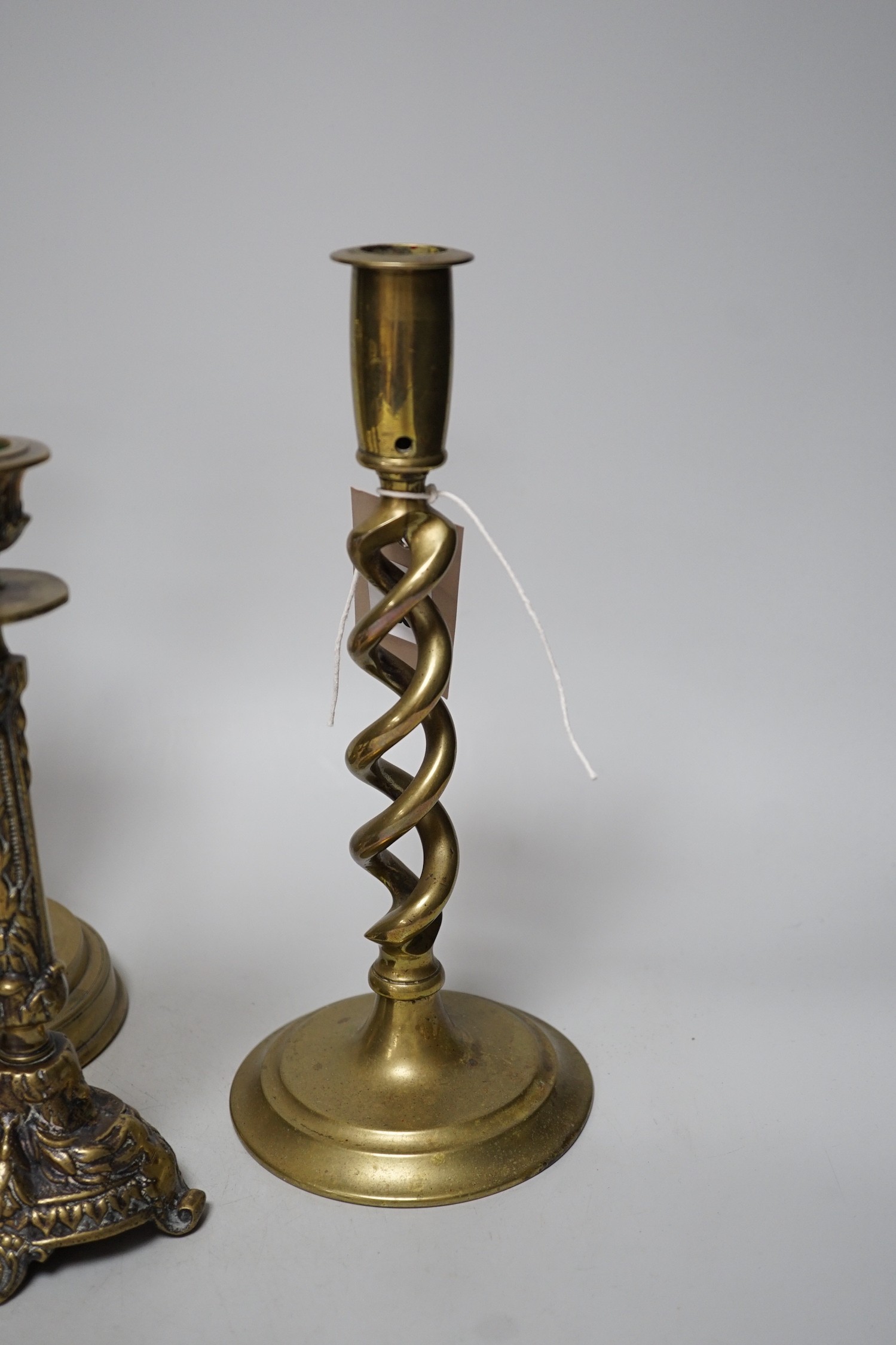 Five various brass candlesticks, tallest 26cms high